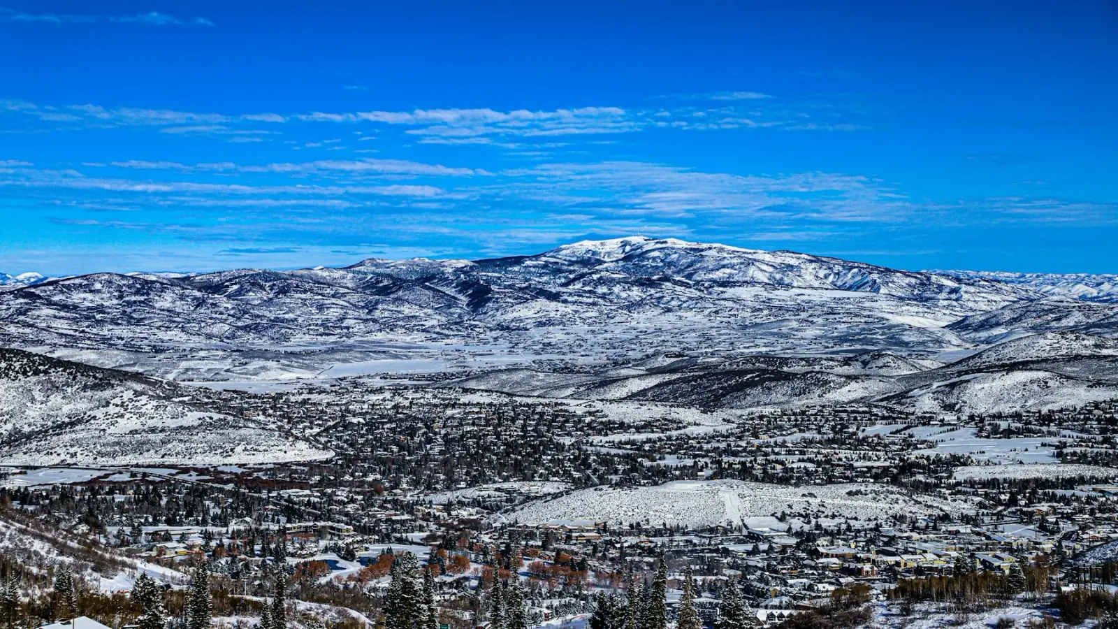 Snowy panorama of Utah's Wasatch mountains from the top of a lift